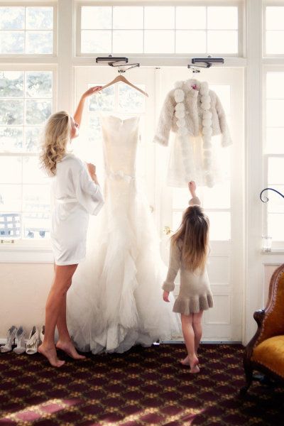 a picture with the wedding dress and flower girl dress