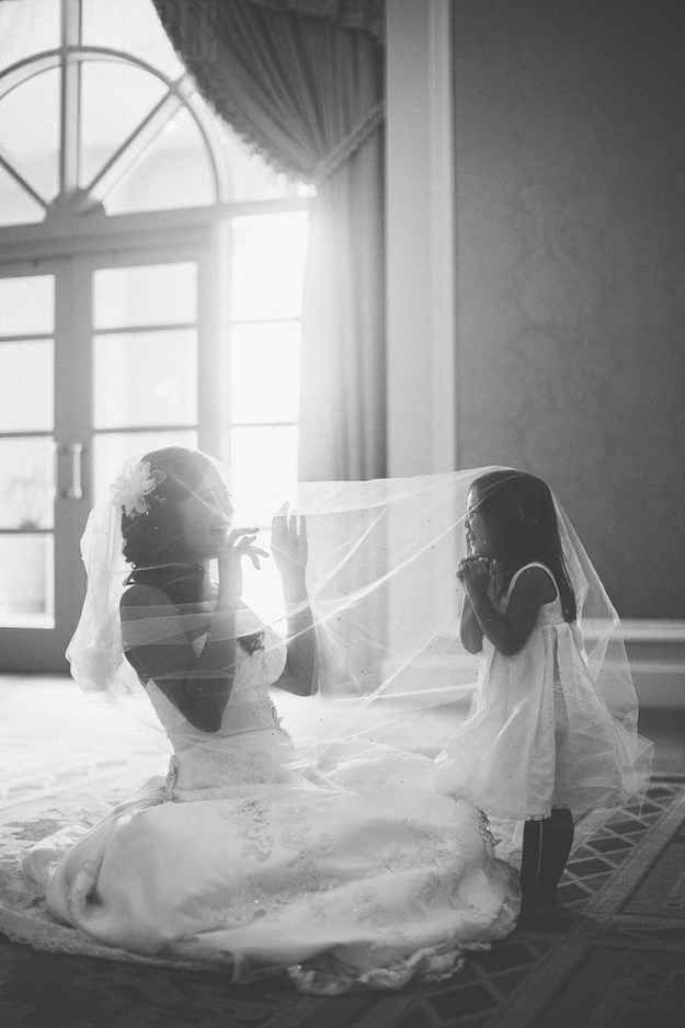 adorable shot of the bride with the flower girl