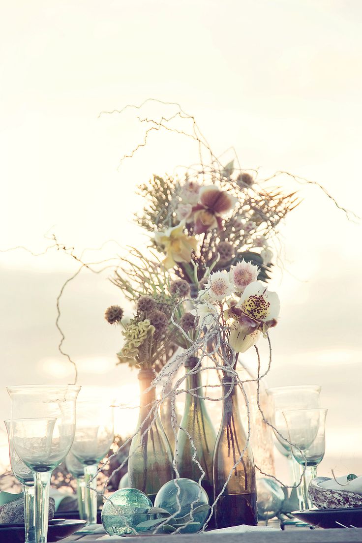 36 Amazing Beach Wedding Centerpieces 2024 35 .beach wedding ideas- wine bottles with flowers