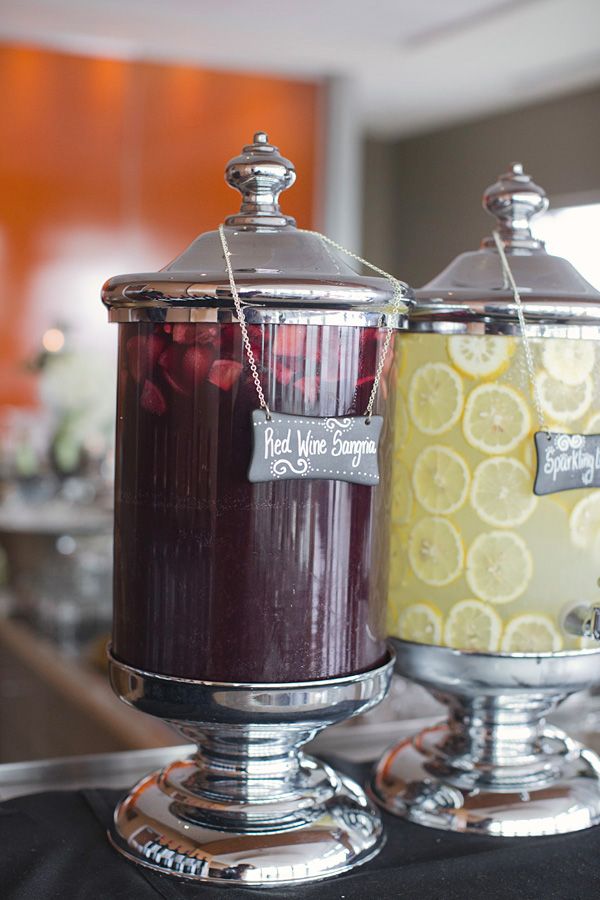 chalkboard labeled red wine drinks at wedding reception