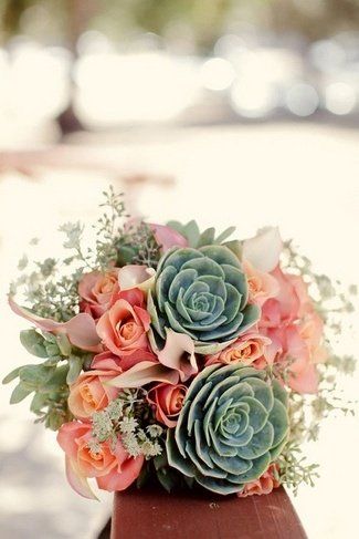 coral pink roses and succulent bridal bouquet
