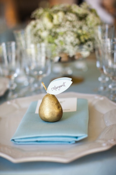 cream light blue gold seating card on pear
