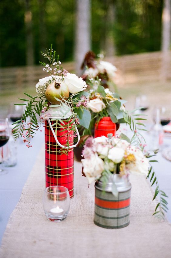 flowers in plaid thermoses as centerpieces