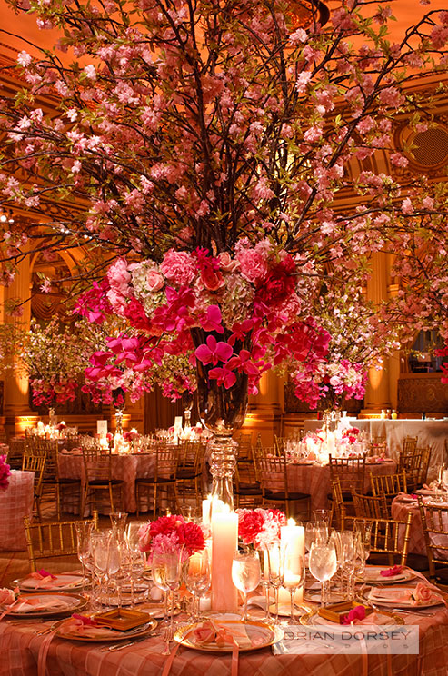 indoor wedding centerpiece of orchids and romantic cherry