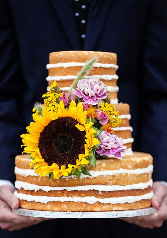 large sunflower topped naked wedding cake
