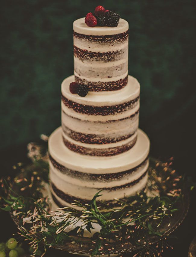 layered naked wedding cake with berries