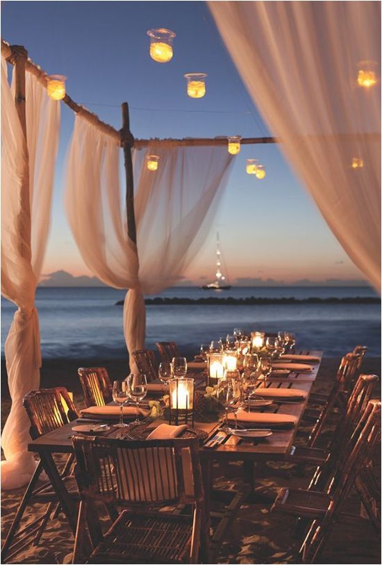 outside beach reception with hanging candle lighting