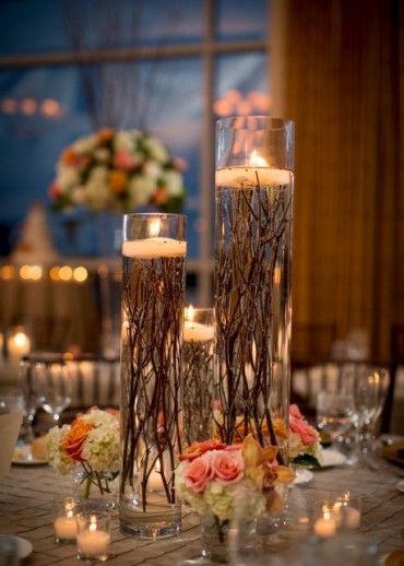 particular centrepiece uses roots instead of petals underneath the candles