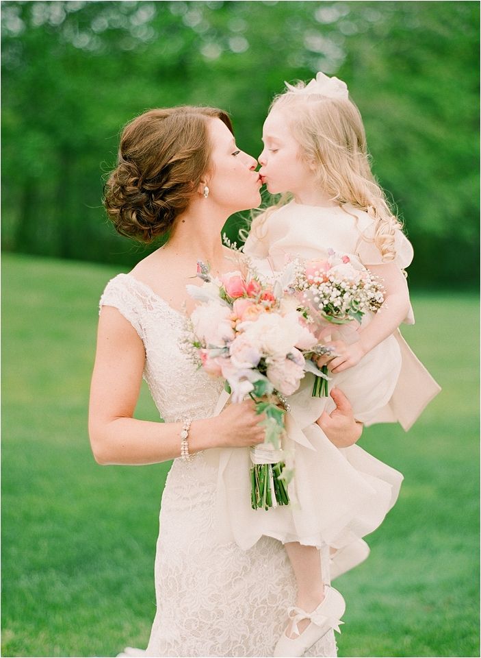romantic wedding photos - bride kiss flower girl