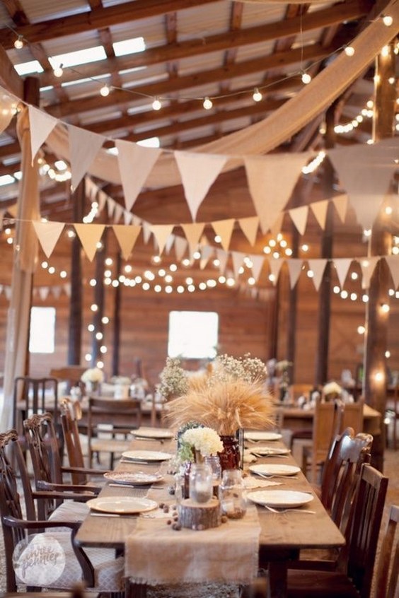 rustic barn wedding reception ideas with white lights and banners