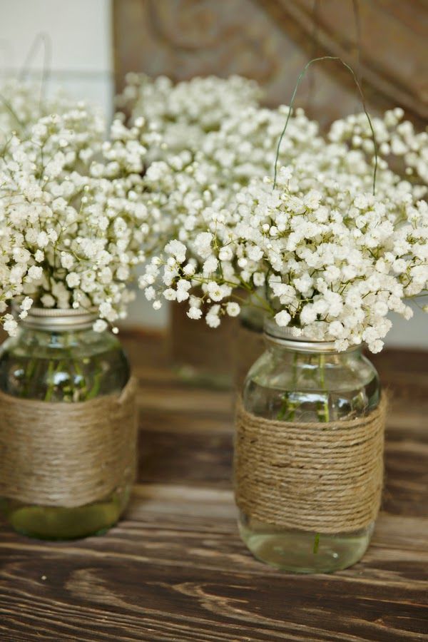 rustic wedding flower - canning jar with jute and baby's breath