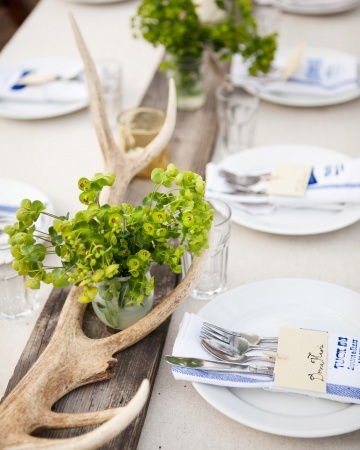 rustic wood and antlers with local flowers form the centerpieces