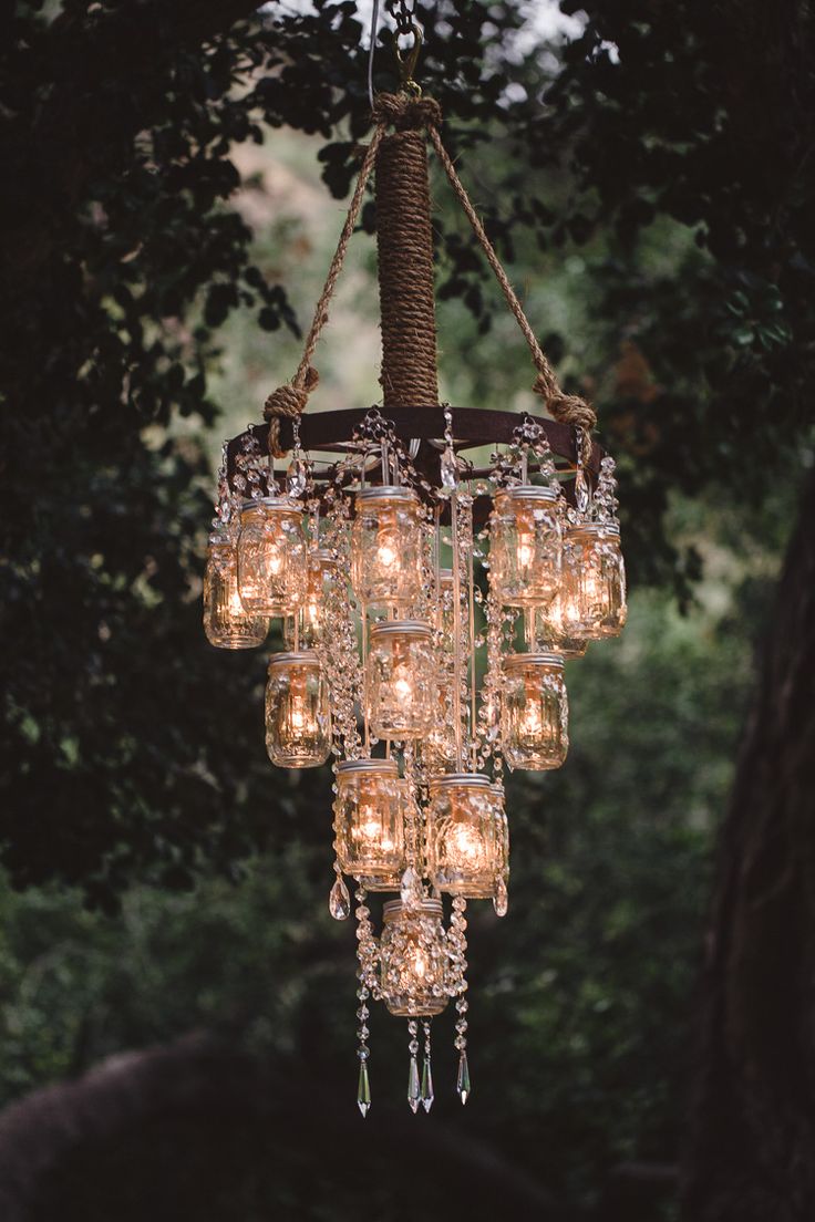 vintage wedding decor with mason jar wagon wheel chandelier