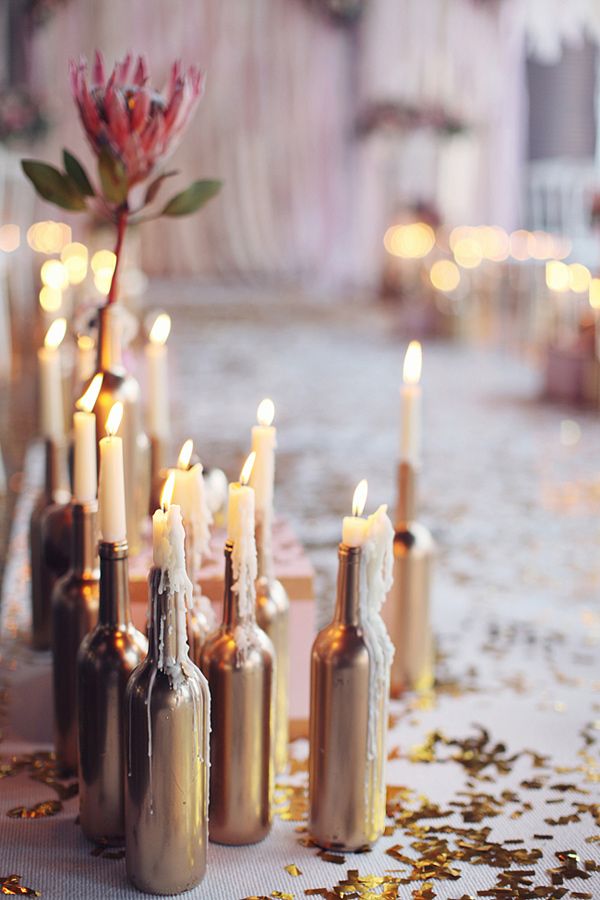 vintage wedding ideas - painted gold bottles as candle holders