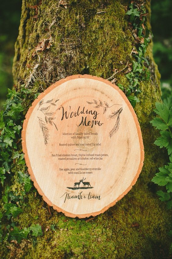 wedding menu carved into a tree stump