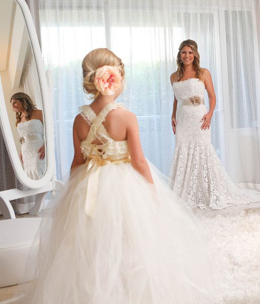 wedding photo ideas - Bride looking at the flower girl