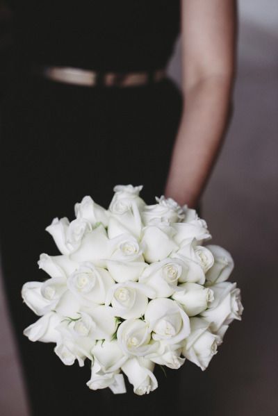 white roses bridesmaid bouquet with black bridesmaid dress