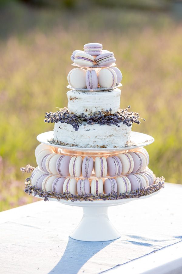 white wedding cake with lavender macaroons