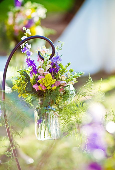 wildflower in mason jars wedding aisle