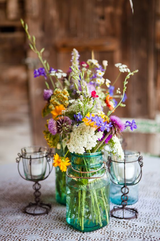wildflowers in blue mason jar wedding centerpiece
