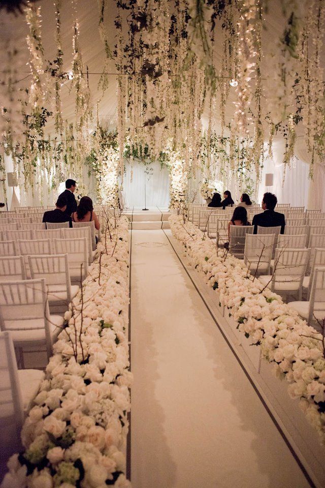 All white wedding hanging flowers winter wedding aisle