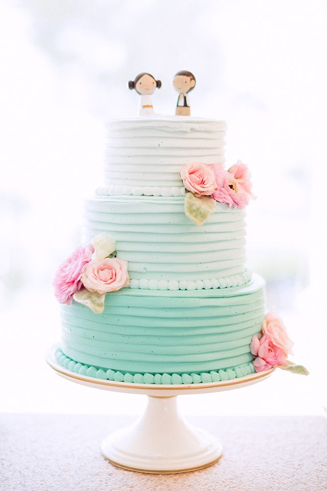 Aqua ombre buttercream wedding cake with pink sugar flowers