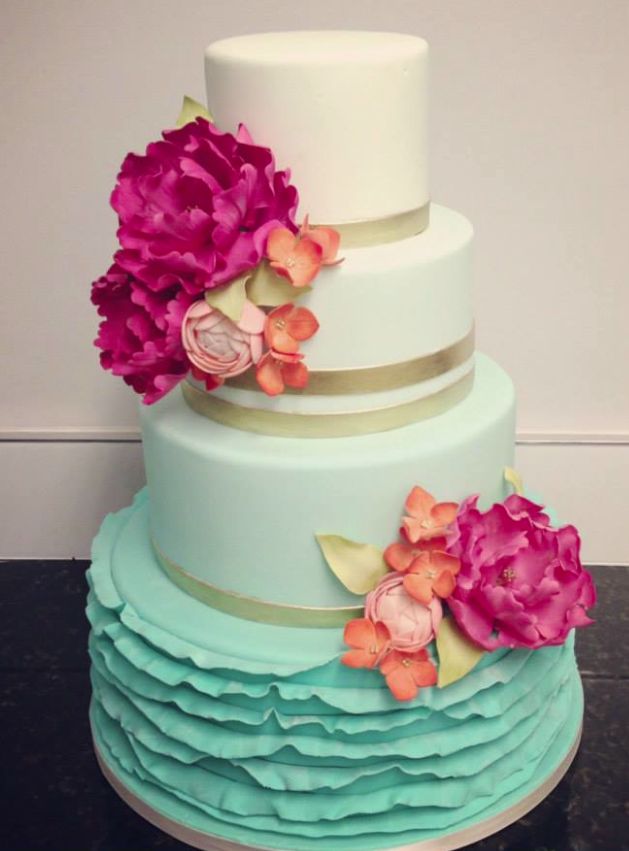 Aqua ombre ruffles wedding cake with sugar plum flowers