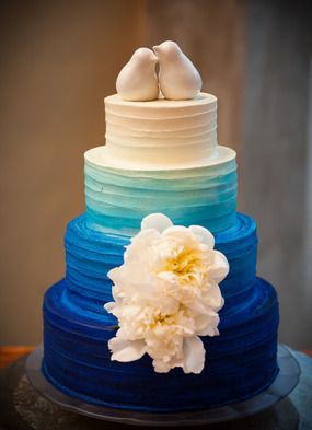 Blue ombre with lovebirds topper wedding cake by Barr Mansion and Artisan Ballroom