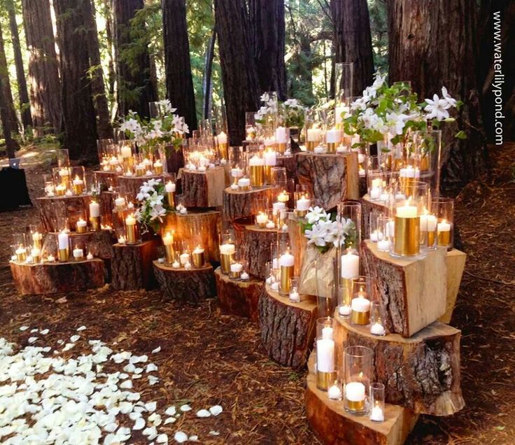 Dramatic stacked wood stump backdrop for wedding ceremony altar