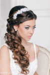 French braided half up wavy wedding hairstyle with headpiece