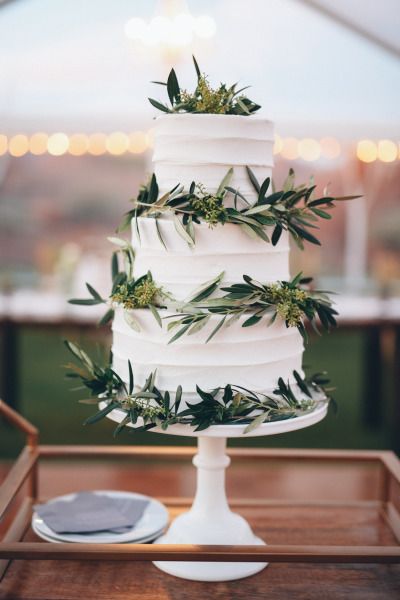 Olive branch covered wedding cake