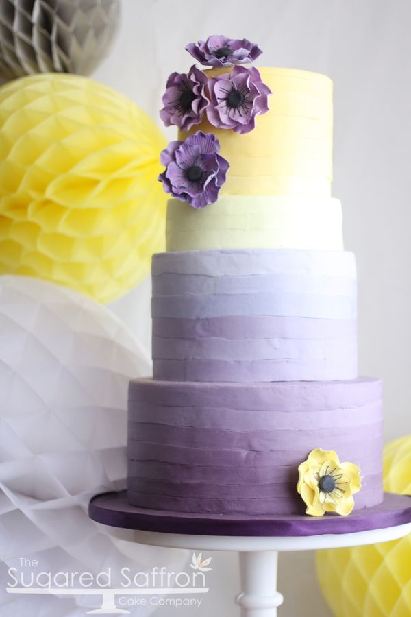 Ombre purple and yellow wedding cake with anemones