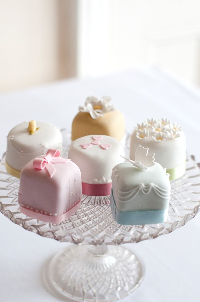 Pastel Little petite fours resembling mini wedding cakes