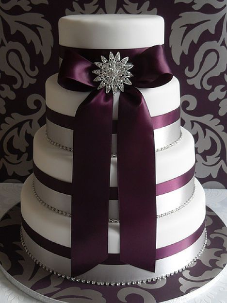 Plum Wedding Cake with Ribbon Centered on Each Tier