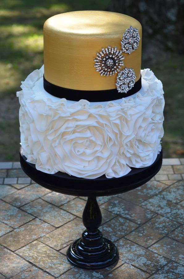 Rosette ruffle wedding cake with gold metallic and brooches