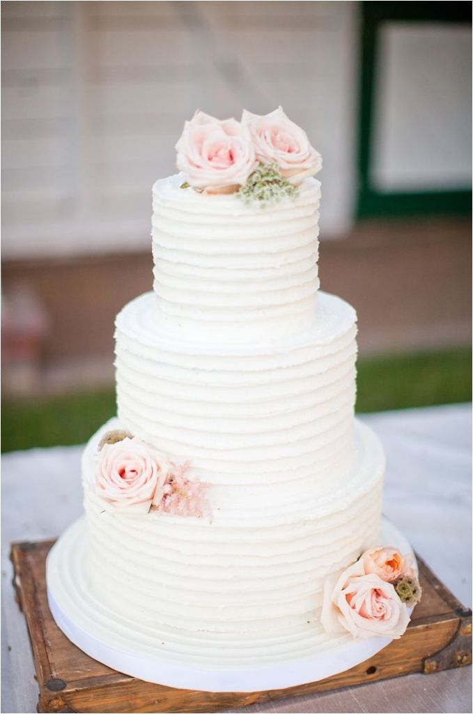 Rustic white wedding cake with blush roses