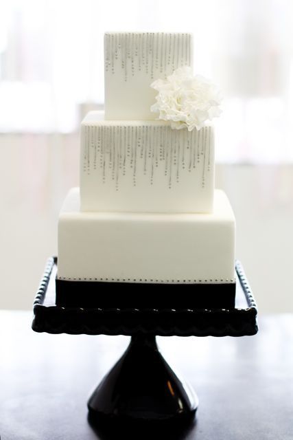 Square tiers silver decorated black and white wedding cake