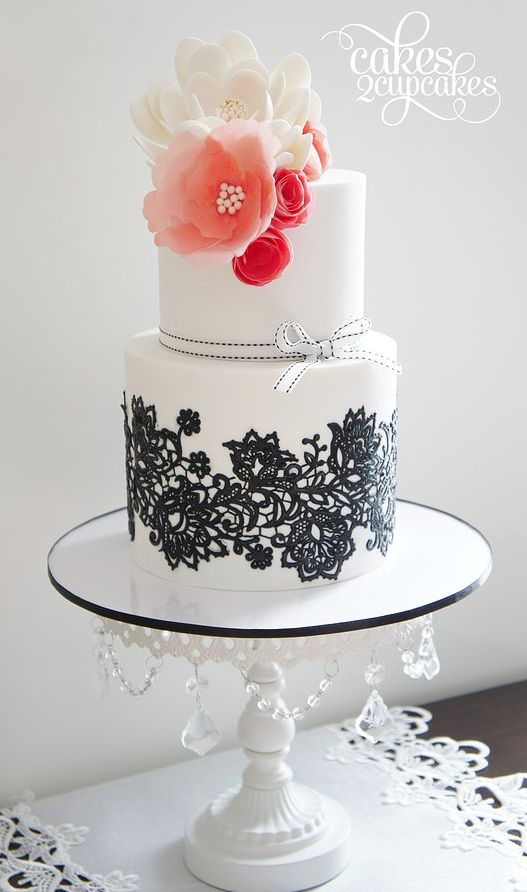 White and Black Lace Wedding Cake with Pink Sugar Flower Topper