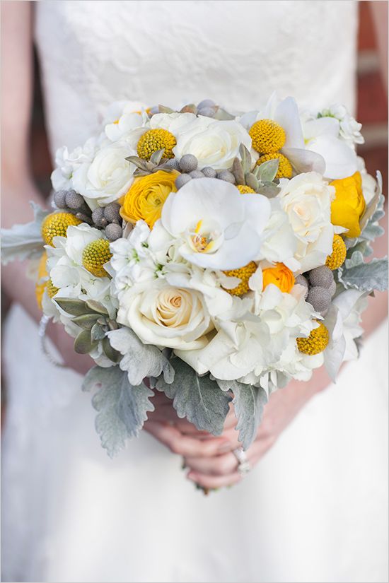 White and yellow wedding bouquet with roses ranunculus brunia hydrangea and billy balls