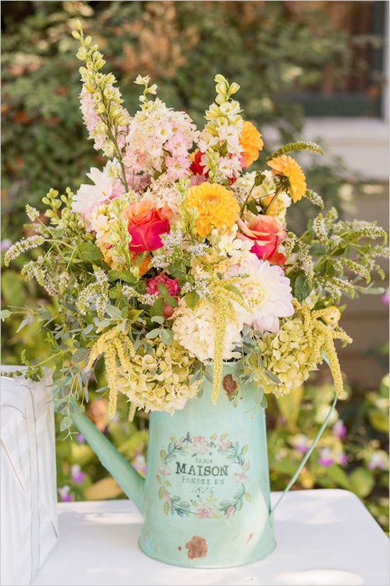 Wild flowers in a watering can- rustic wedding decor