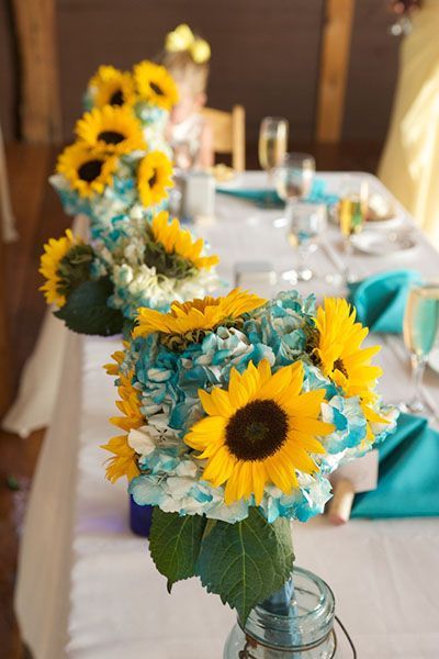 Yellow sunflowers and tiffany blue flower wedding cengterpieces