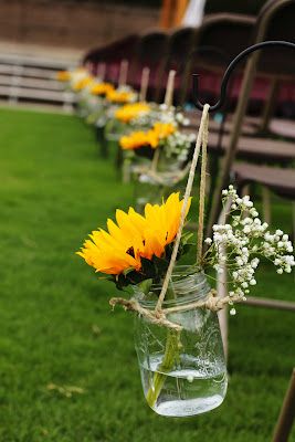 50+ Ways To Incorporate Mason Jars Into Your Wedding 8 aisle decorations-sunflowers in mason jars