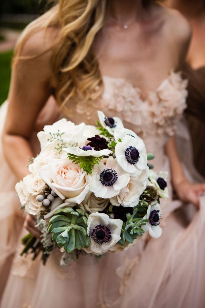 anemone bouquet and blush wedding dress