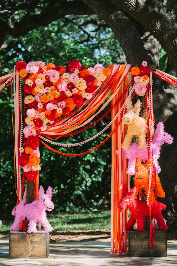 asymmetrical pink and red flowers wedding ceremony backdrop