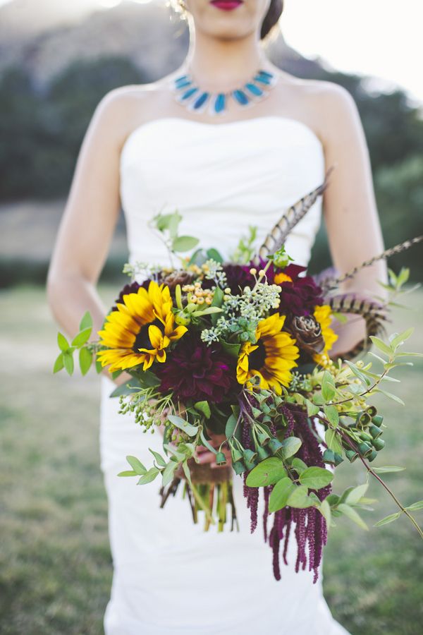 autumn wedding bouquet with sunflowers and feathers