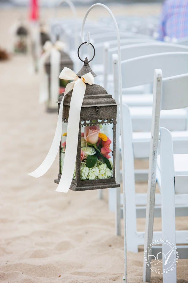 beach wedding aisles-wooden lanterns with flowers lining the aisle