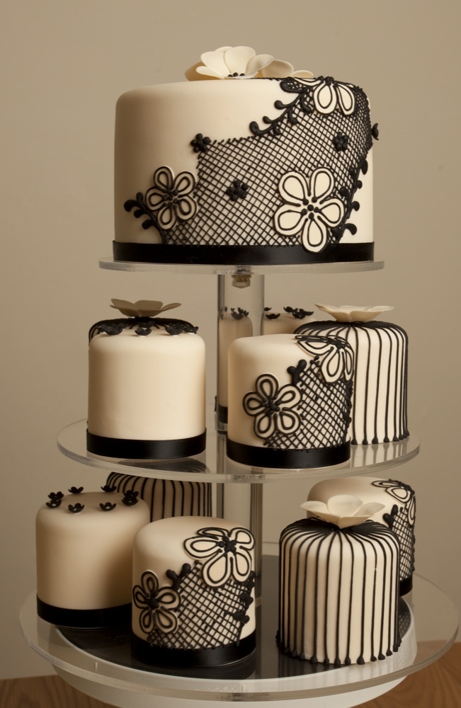 black and white lace wedding cake and cupcakes