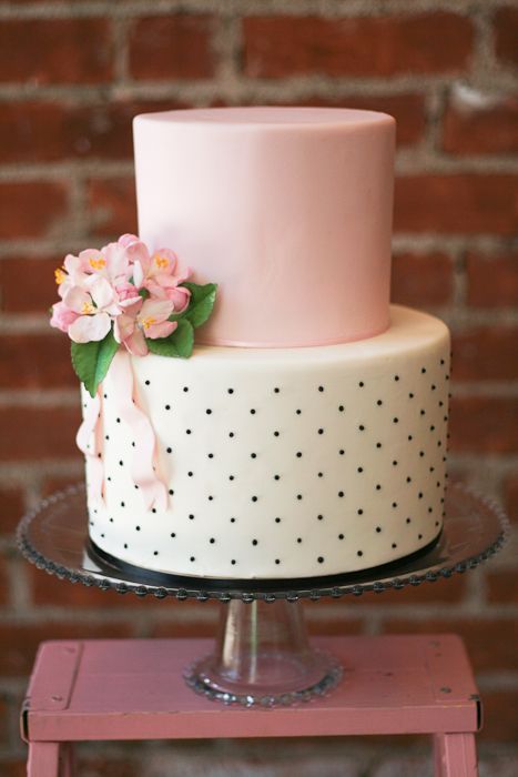black and white wedding cake with blush pink flowers