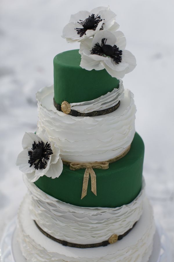 emerald and white wedding cake with anemones