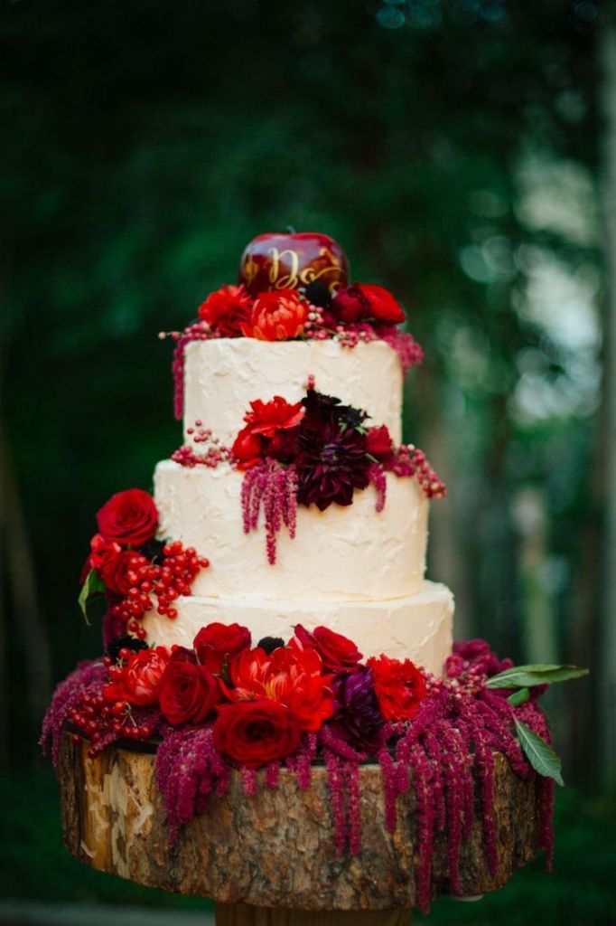 fall wedding cake with red flowers
